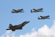 Heritage flight F-22 Raptor and three Mustangs